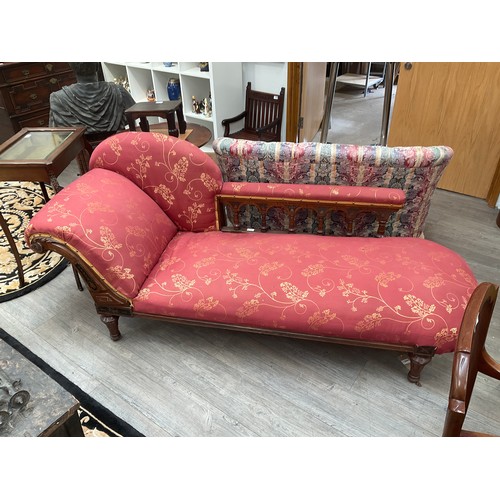 1136 - A Victorian chaise lounge with silk burgundy and gold upholstery, arch back