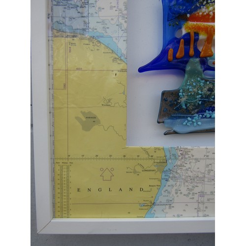 7245 - A studio glass panel of various colours, framed with a map mount depicting the Norfolk & Suffolk Coa... 