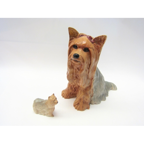 1340 - A Beswick Yorkshire Terrier (fireside model) in gloss, model no. 2377 (ear restored) together with a... 