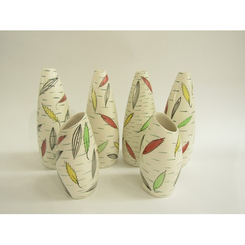 7019 - Six Vulcan ware vases decorated with stylished leaves. Tallest 20.5cm