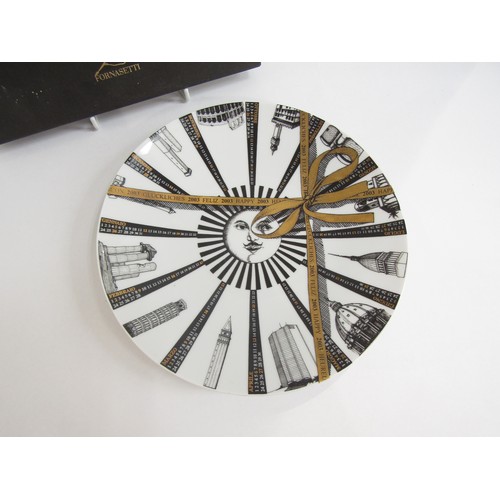 7021 - A Fornasetti 2003 calender plate, No 43/750, 23.5cm diameter.  In an associated Rosenthal Fornasetti... 