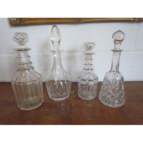 1020 - Four decanters including crystal, tallest 31cm (with stopper)   (E) £10-20