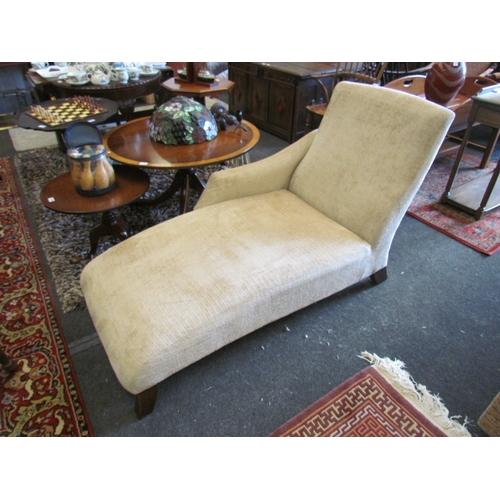 1095 - A mushroom colour upholstered contemporary chaise longue