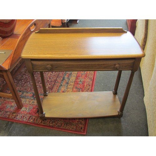 1108 - An Ercol hall table No. 1192, golden dawn finish, with single drawer and under-shelf