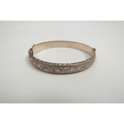 1279 - A silver bangle and another white metal ornate example  (C)