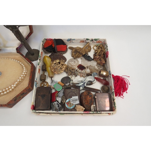 1294 - A box of miscellaneous including silver vesta, vesta as a brazil nut, pen knives, medals, wax seal i... 