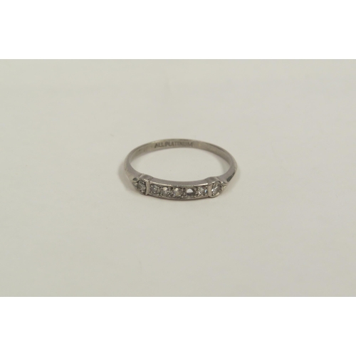 1300 - A Platinum ring set with small diamonds, one loose   (C)