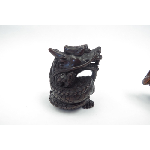 1308 - Three boxwood netsuke - horse, dragon, Chinese Dog of Fo and an ivorine figure