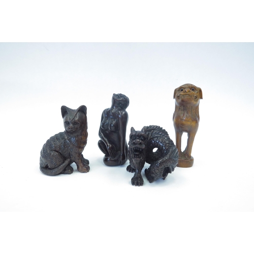 1312 - Three boxwood netsuke - cat, dragon, Dog of Fo and a nude female figure (4)