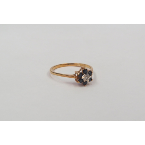 1315 - An 18ct gold sapphire and diamond cluster ring, 1.9g