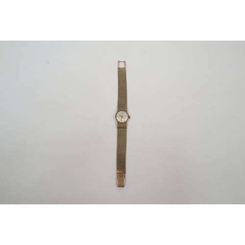 1317 - A 9ct gold Omega lady’s wristwatch, round face with line markers, 28.9g