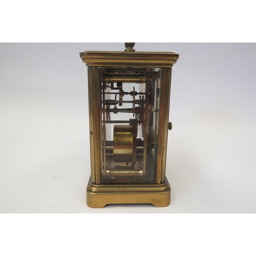 1341 - A brass cased carriage clock, enamel face, Roman numeral dial, with key