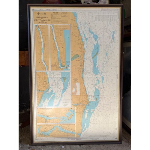 8020 - A mirrored hydrographic atlas, sail plan print, lighthouse photographic print and a 1980s ‘Approach ... 