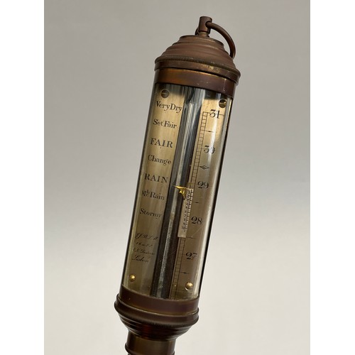 8037 - A nautical style gimballed brass ship's barometer, the dial marked J.J.B.L.M. 16a22 R.N. Desterro Li... 