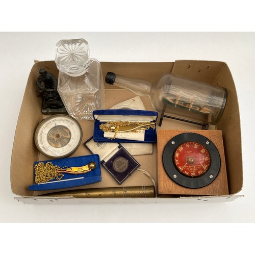 8043 - A box of miscellaneous including a ship in a bottle, compass and a bronze figure etc