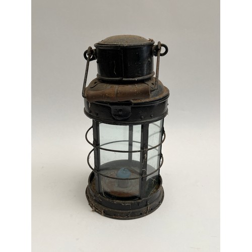 8101 - An early 20th Century black painted metal candle lantern