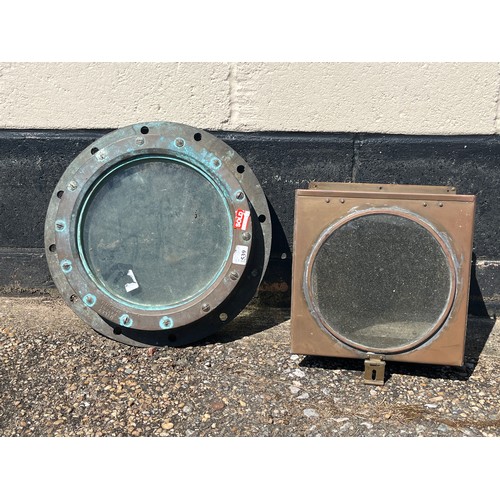 8078 - A cast brass ship’s porthole together with a compass cover (2)