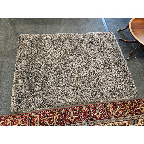 1500 - A brown and beige shag pile rectangular ground rug, 165cm x 225cm    (R)  £30