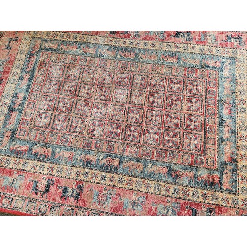 1501 - A Persian style red ground Bokhara rug, 189cm x 133cm