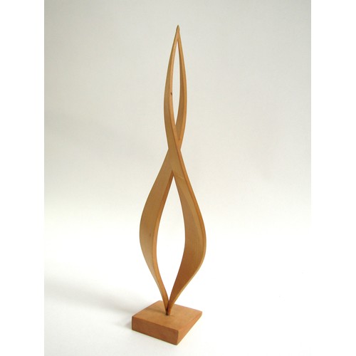 7546 - An abstract form wooden sculpture, unsigned. 41cm high