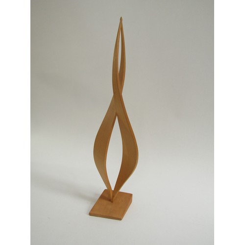 7546 - An abstract form wooden sculpture, unsigned. 41cm high