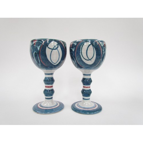 7130 - A pair of Aldermaston Pottery studio goblets by Alan Caiger Smith, painted marks to base.  18cm high... 