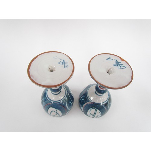 7130 - A pair of Aldermaston Pottery studio goblets by Alan Caiger Smith, painted marks to base.  18cm high... 