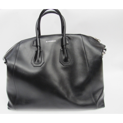 6003 - GIVENCHY - Stunning ANTIGONA SPORT medium size bag designed with a smooth black leather exterior, ov... 