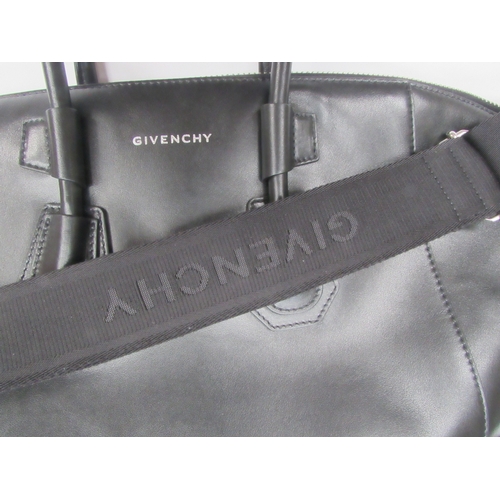 6003 - GIVENCHY - Stunning ANTIGONA SPORT medium size bag designed with a smooth black leather exterior, ov... 