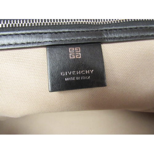 6003 - GIVENCHY - Stunning ANTIGONA SPORT medium size bag designed with a smooth black leather exterior, ov... 