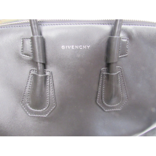 6003 - GIVENCHY - Stunning ANTIGONA SPORT medium size bag designed with a smooth black leather exterior, ov... 