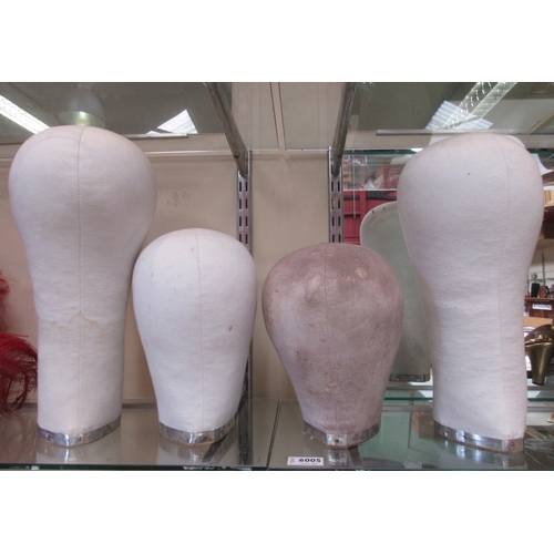 6005 - Four various sized wig stands  (E)  £30-40