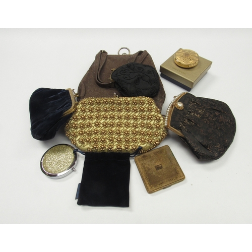 6022 - A box containing a small quantity of table linens, 20th Century evening bags and four compacts to in... 