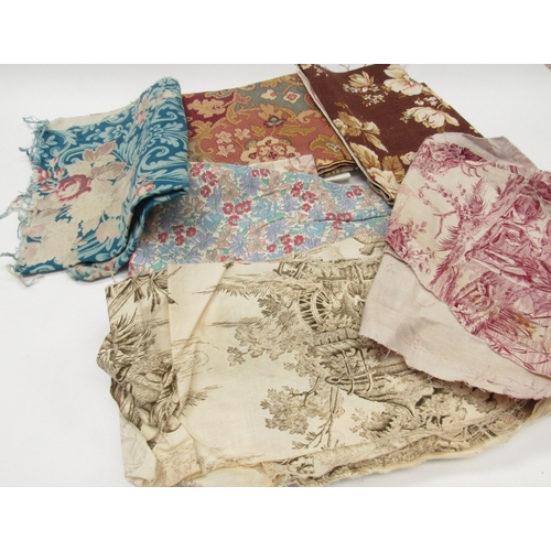 6024 - A basket containing various vintage fabric pieces, Paisley, toile de jouy, florals, checks, etc