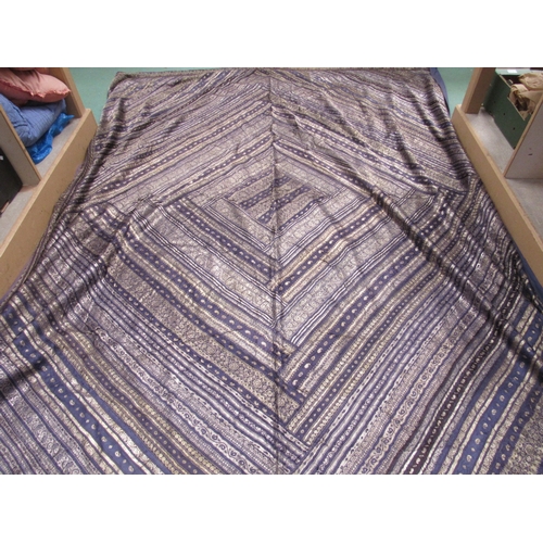 6063 - An Indian silver wirework and indigo bed cover with a number of Indian stylised motifs, backed onto ... 