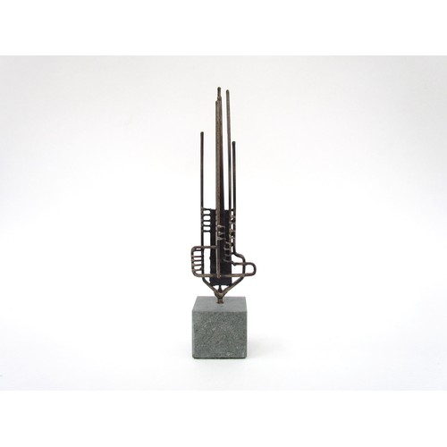 7549 - A stylised abstract metal sculpture on a stone base, unsigned. 25cm high