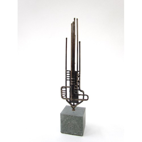 7549 - A stylised abstract metal sculpture on a stone base, unsigned. 25cm high