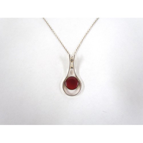 7251 - A Finnish sterling silver modernist pendant with cornelian stone, marked Made in Finland