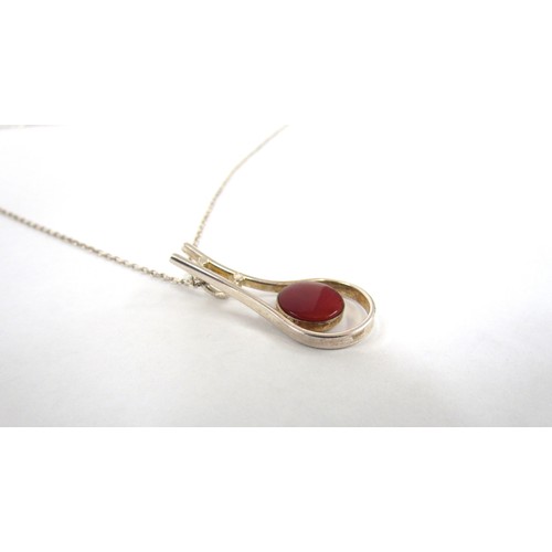 7251 - A Finnish sterling silver modernist pendant with cornelian stone, marked Made in Finland