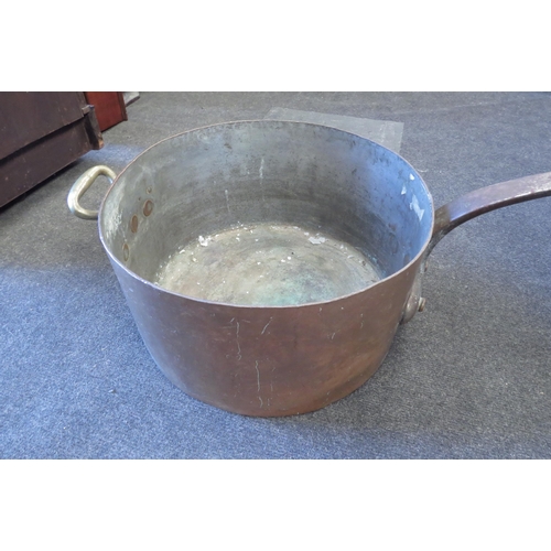 1002 - A large scale copper pan (37cm diameter) stamped G.W.R..  78cm overall length   (E) £40-60