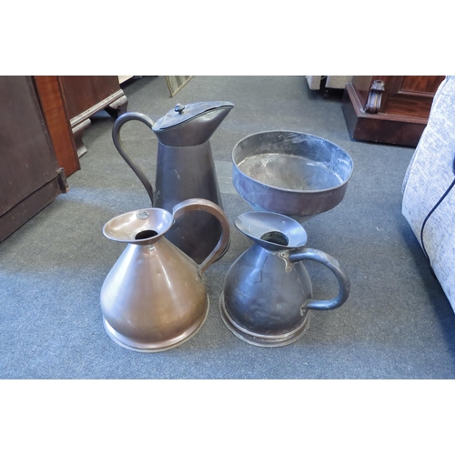 1003 - Two large copper jugs, a one gallon measure and a funnel. Tallest is 42cm high (4)