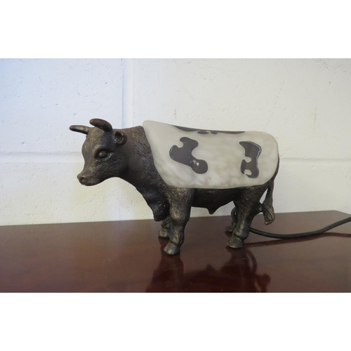 1010 - A cast metal cow form lamp