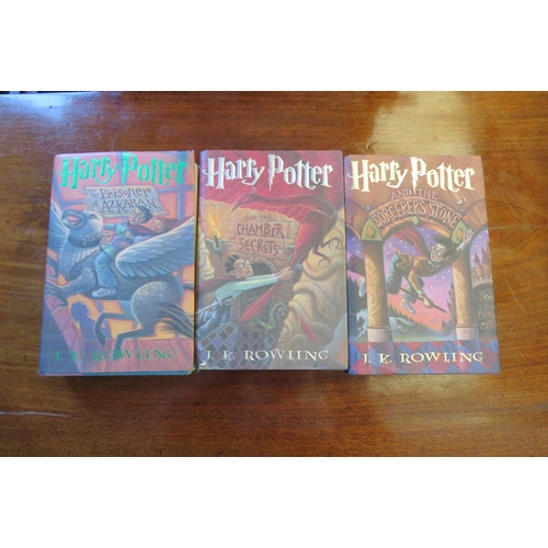 1016 - Three American edition Harry Potter novels including 'The Sorcerer's Stone', 'Chamber of Secrets' an... 