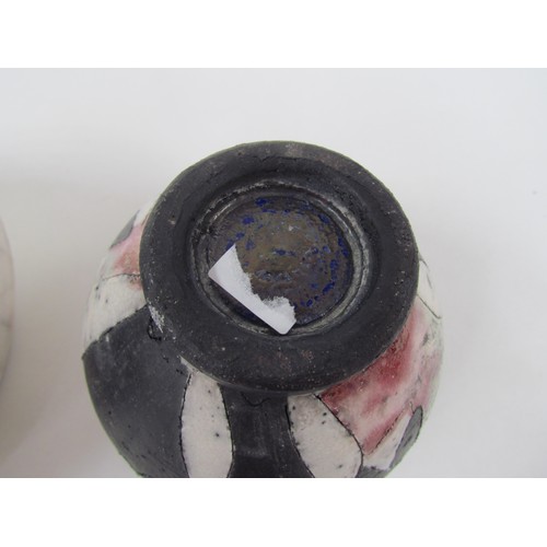 7067 - A studio pottery raku vase with oval banded decoration, initialled JS to base and a smaller raku pot... 