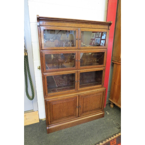 1080 - A circa 1930 oak Globe Wernicke style lawyer's four section stacking bookcase of six glazed doors an... 