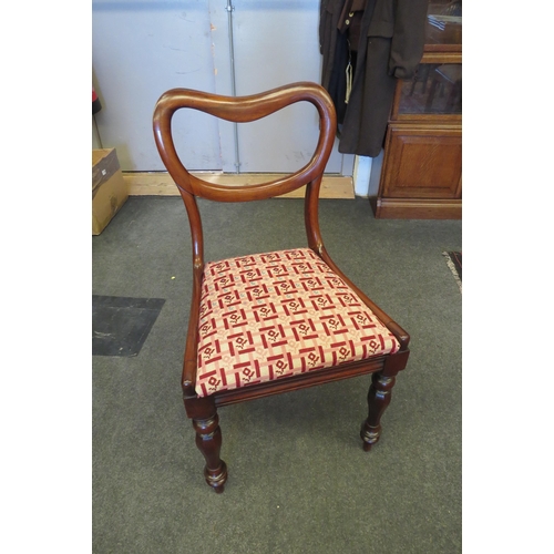 1083 - An early Victorian rosewood kidney shape back chair, the needlepoint seat over turned and chamfered ... 