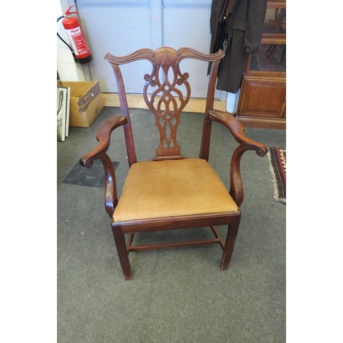 1085 - A Georgian mahogany Chippendale style armchair, the carved scroll backrest with pierced central spla... 