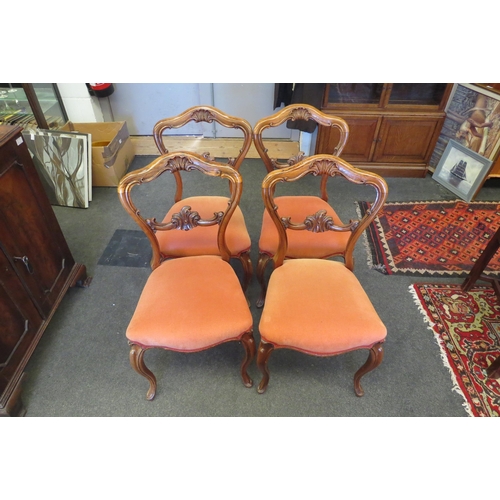 1088 - A set of four early Victorian carved rosewood chairs on cabriole fore legs   (R) £40