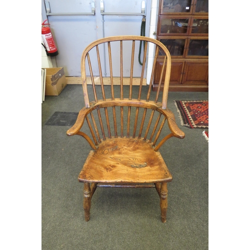 1111 - A late 18th Century Windsor stick-back armchair on turned supports joined by stretcher