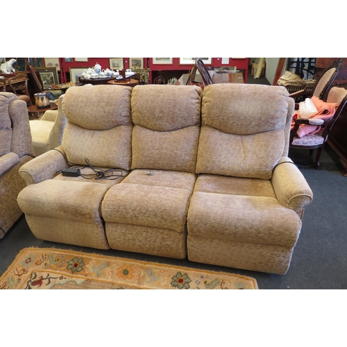 1138 - A modern beige electric reclining sofa, built up of three sections, both ends recline while the midd... 